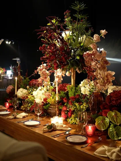 Another angle of the decadent floral runner, filled with a variety of blooms like roses, hydrangeas, and orchids in a rich color palette.