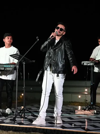 Here is a look at my full band setup during an outdoor concert. We bring a high-energy, rockstar vibe perfect for making a big impact at corporate offsites or private celebrations. This setup includes professional sound and lighting to create a complete concert experience.