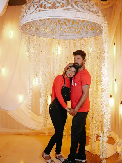 A tender moment under the same floral canopy, perfect for a romantic and dreamy photoshoot.