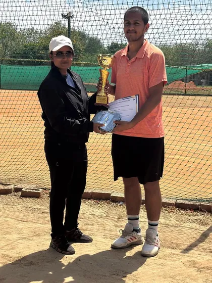 Kshitij Sinha, the runner up, receiving his trophy and prize. Consistent match play in our tournaments is crucial for player development and building mental toughness.