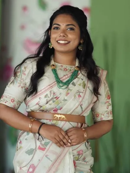 A closer look at Nupura's custom blouse. The delicate embroidery and tailored fit pair beautifully with her printed saree and statement necklace.