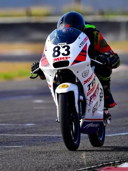 A head-on shot of Siddesh on his Pro Stock 165-200cc race bike, focused on the track ahead.