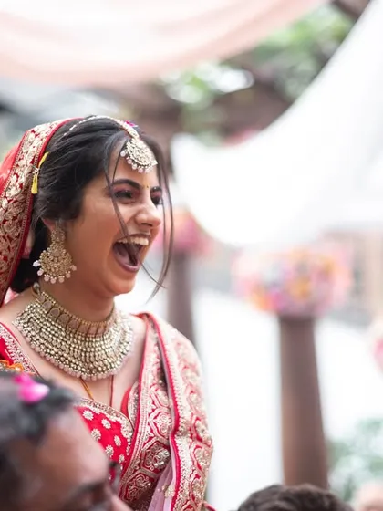 The bride's unrestrained laughter during a fun moment in the ceremony.