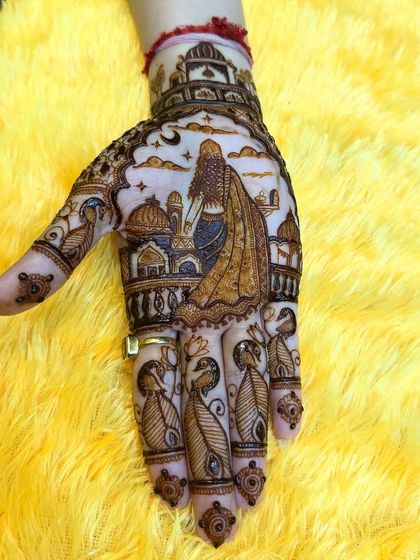 A single hand view of the beautiful Karwa Chauth design, highlighting the grace of the figure and the surrounding patterns.