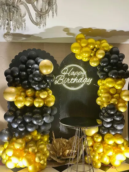 Turning 50 in style! We designed this glamorous disco-themed birthday party using a bold black and gold palette, a custom neon sign, and dramatic balloon arrangements to create a chic and celebratory vibe.