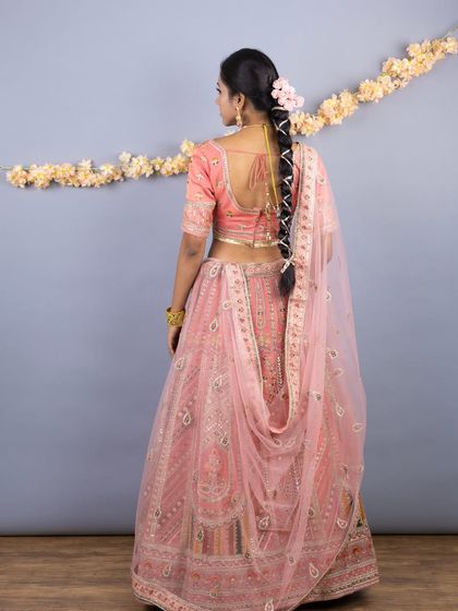 The back view again, this time showing the full length of the dupatta and the beautiful details of the blouse.