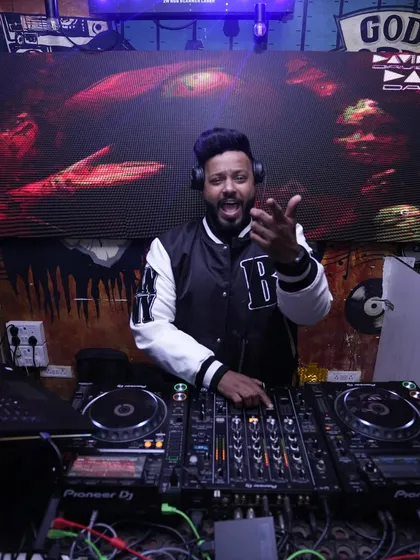 The vibes at Booze Buzz Inhouse are always on point. You can see my custom VJ graphics on the screen behind me.