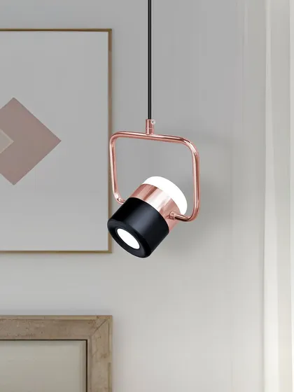 A close-up view of the rose gold and black spotlight pendant. The quality of the finish and the clean design are evident.