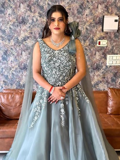 A full view of this stunning engagement gown. The intricate silver embroidery on the bodice is the star of the show.