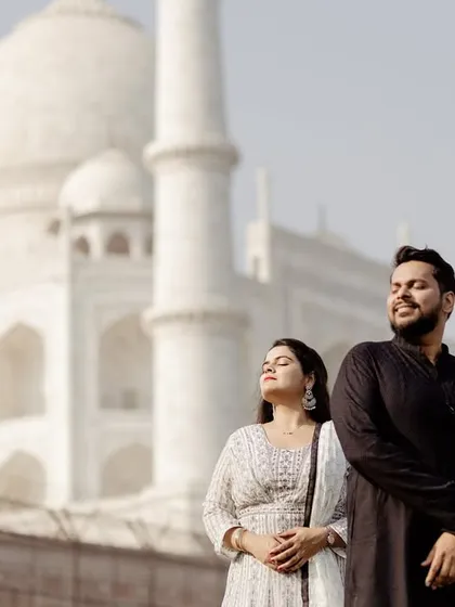 A sun-kissed candid moment, showing the couple enjoying the warmth and beauty of the location. Natural light is key to creating these warm, genuine portraits.