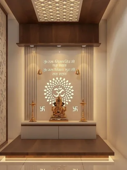This compact pooja unit demonstrates how we create beautiful sacred spaces even with limited room. The design incorporates a backlit Om mandala, engraved Sanskrit shlokas, and a raised platform for the Ganesha idol, all framed by rich wood and elegant jali panels.