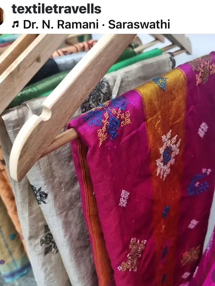 A rack of my hand-embroidered sarees at the studio, showing the variety of colors and patterns I offer. Each one is a unique piece waiting to be cherished.
