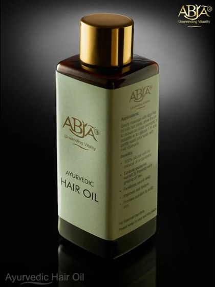 A studio shot of my Ayurvedic Hair Oil, a potent combination of amla, bhringraj, and neem to strengthen roots and control dandruff.