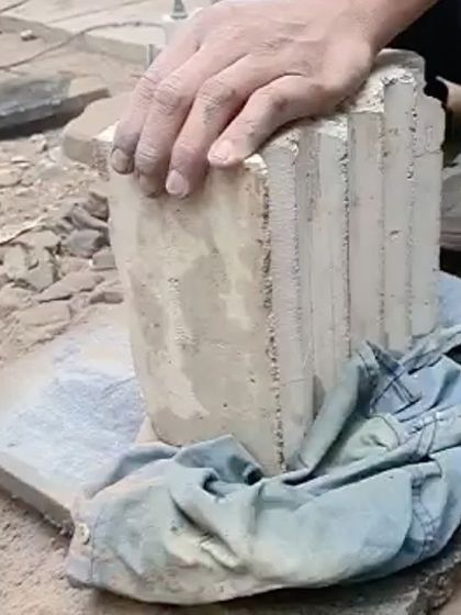 Our process often involves material experimentation. Here, we are testing a new technique, creating a concrete block using wood waste from a furniture factory as an aggregate.