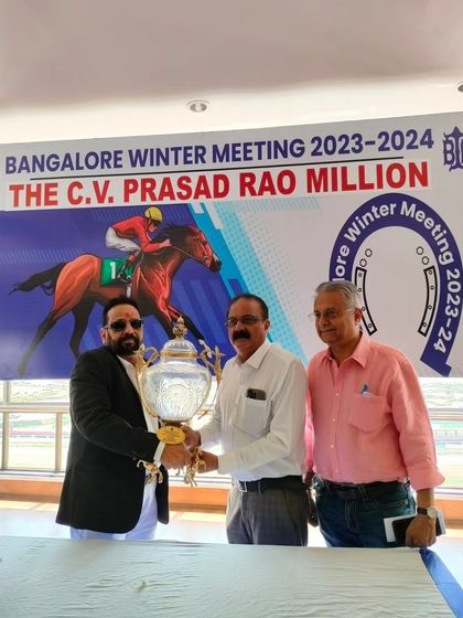 The official presentation of the trophy to the sponsor during the press meet, solidifying the partnership in the public eye.