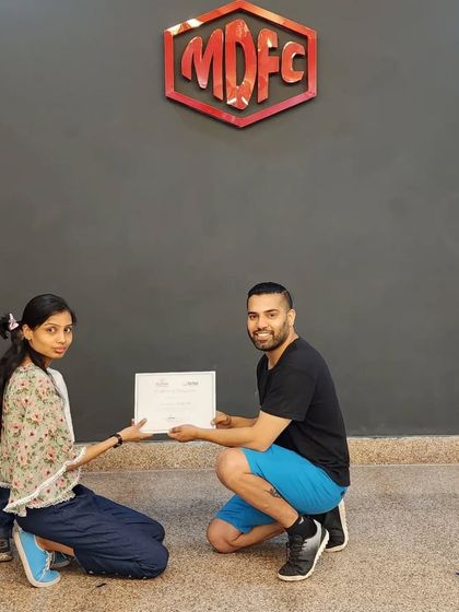 Presenting a certificate to one of our adult students, celebrating her dedication on International Dance Day.