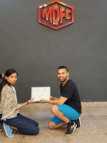 Presenting a certificate to one of our adult students, celebrating her dedication on International Dance Day.
