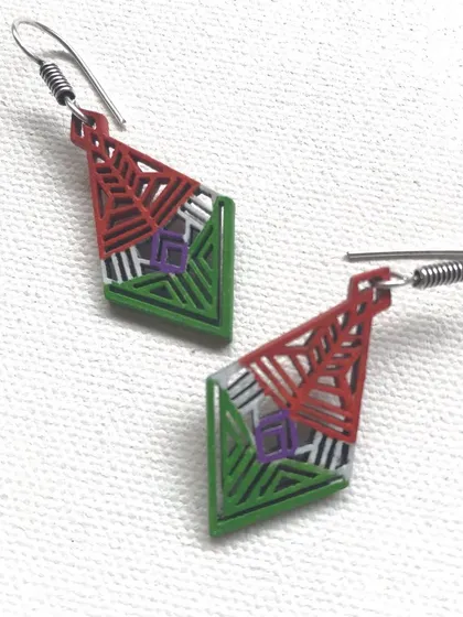 I created these lightweight, hand-painted earrings for Independence Day. The geometric design features the colours of the tiranga, making it a subtle and artistic patriotic accessory.