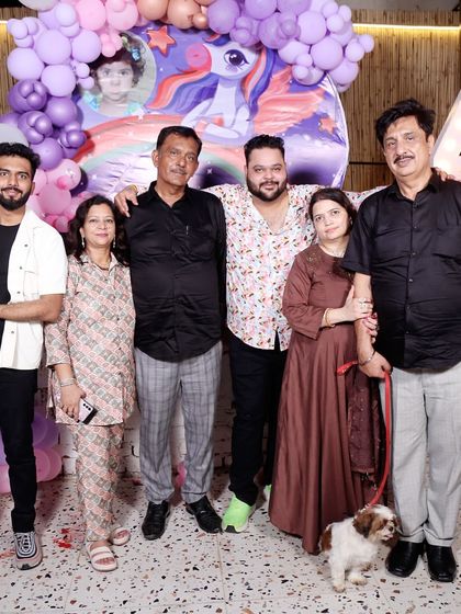 It’s a family affair. I love seeing families and their furry friends celebrate milestones with us. This photo captures a happy moment from a 4th birthday party we hosted.