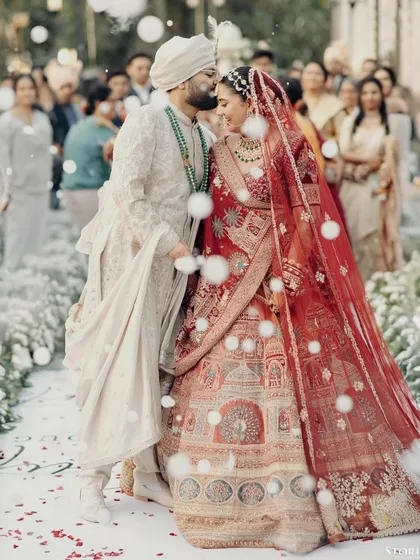 A quiet moment of affection amidst the ceremony. For me, capturing these unscripted gestures is just as important as the grand rituals. This is the timeless love story of Kunal and Parul.
