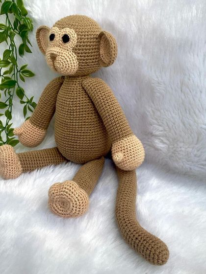 A playful monkey with a long tail, perfect for swinging around. This is my own custom design, and he's ready for lots of jungle adventures.