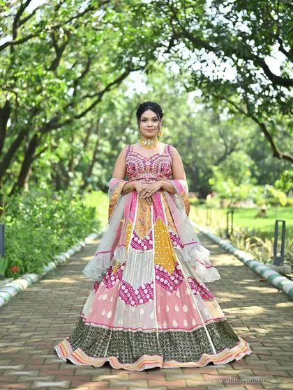A full-length shot of the multi-colored lehenga, showing its grand flare and vibrant patchwork design.