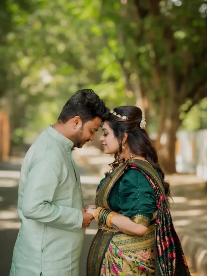 I love capturing the beauty of tradition. This engagement shoot blended Maharashtrian and Bengali cultures, and this quiet moment between the couple, surrounded by greenery, shows the gentle start of their new life together.