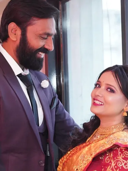 A lovely, happy moment between the couple. Her makeup looks fresh and radiant.