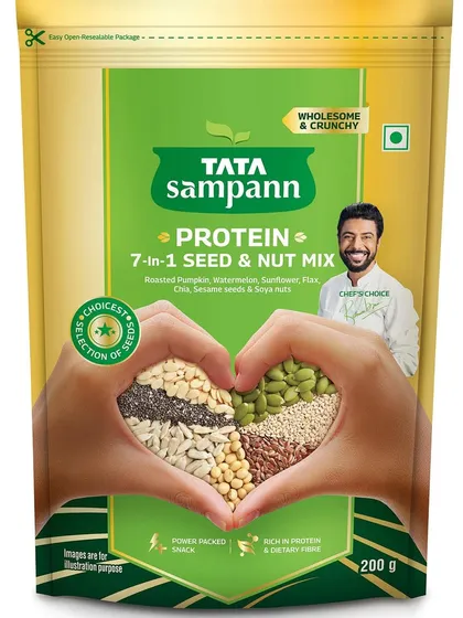 This is a simulation of the final packaging for Tata Sampann's 7-in-1 Seed & Nut Mix. The central image features hands forming a heart shape filled with the product, a concept designed to communicate health and love.