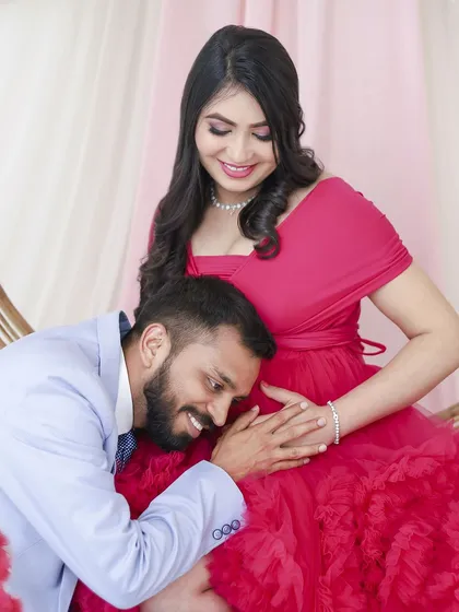 A sweet and intimate pose, with the dad-to-be listening to the baby's kicks. It's these quiet, unscripted feelings we aim to capture in our couple's maternity sessions.
