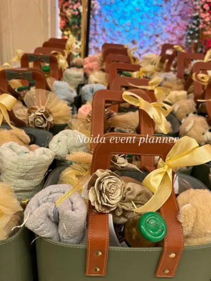 A closer look inside our popular olive green tote bag hamper. This one includes a soft hand towel, a cute teddy bear, a jar of gourmet honey, and other small treats, all beautifully arranged.