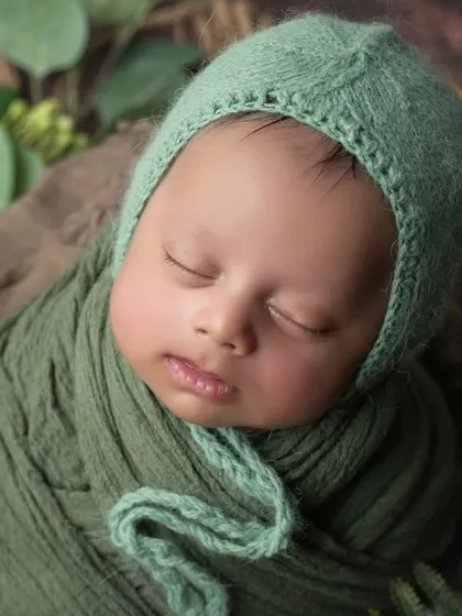 A slightly different angle, capturing the soft light on his cheek. These close-ups are essential in every newborn session.