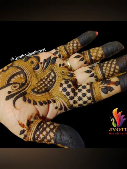 A close-up of the Indo-Arabic peacock design, showing the clean lines and detailed shading on the palm.