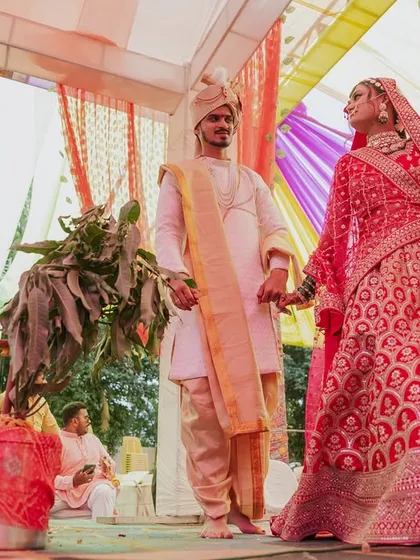 The bride and groom taking their first steps together as a married couple during the ceremony.