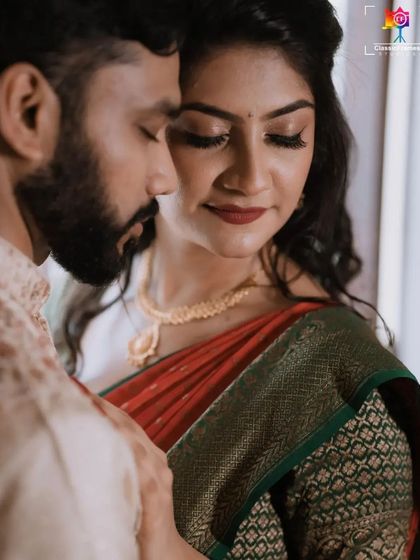 A close-up, intimate portrait capturing the tender connection between the couple. The soft lighting enhances the romantic mood.