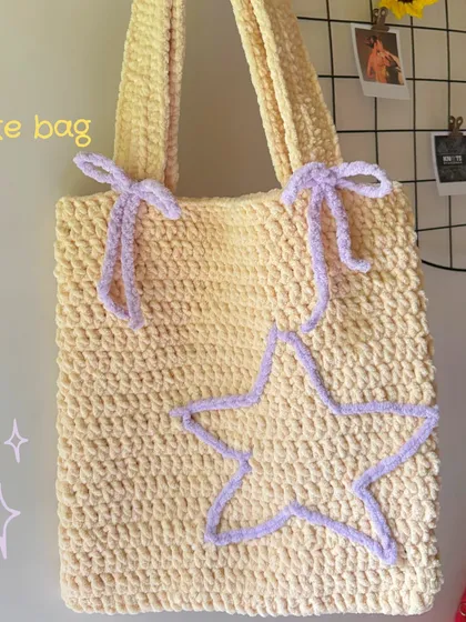 A closer look at the texture and details of my star and bow crochet tote bag. The plush yarn makes it super soft to the touch while being sturdy enough for everyday use.
