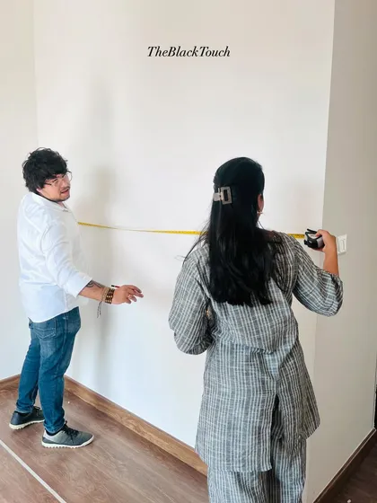 Taking precise measurements of a room. This foundational step is crucial for our "what you see is what you get" promise, as it ensures all custom furniture and fittings will be a perfect fit.