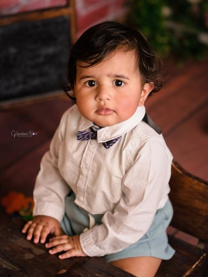 A gallery of our popular school and library theme. These images show the versatility of the brick wall backdrop, mini school desk, globe, and book props for creating a variety of scholarly and classic portraits.