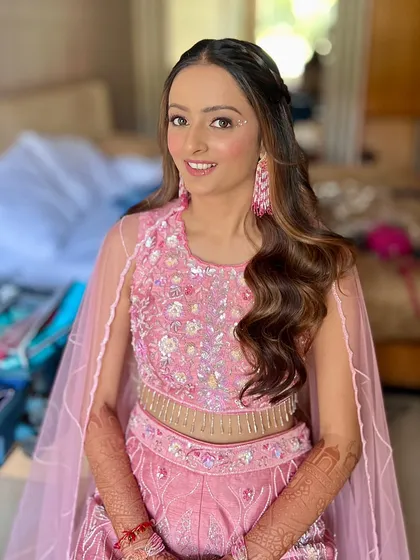 The final look, featuring a soft pink monochromatic style with pearl accents. It's a dreamy and romantic look, perfect for a haldi or a themed party.