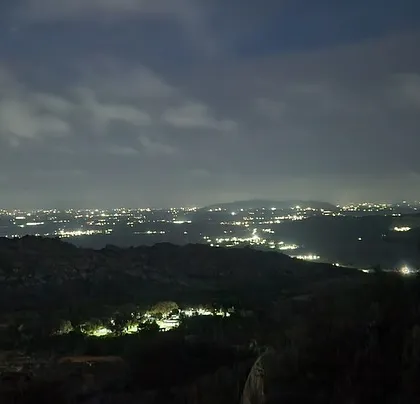 The view from Anthargange at night, with the city lights twinkling in the distance.
