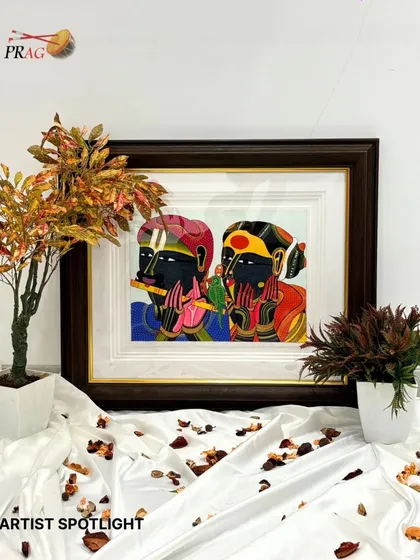 An 'Artist Spotlight' view of a Thota Vaikuntam piece, beautifully framed and staged to highlight its vibrant colors and cultural significance.