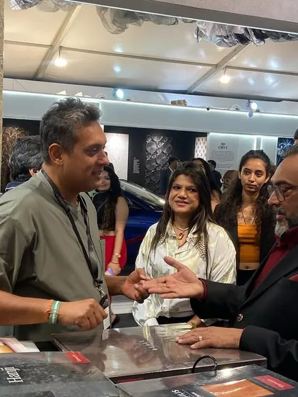 A moment of deep discussion about our fabric collections. These interactions allow me to understand my clients' needs and guide them to the perfect selections.