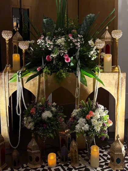 A lavish and romantic setup for a 10th wedding anniversary. We used ornate golden lanterns, pearl strings, and beautiful floral arrangements to create a magical, Arabian nights inspired corner.