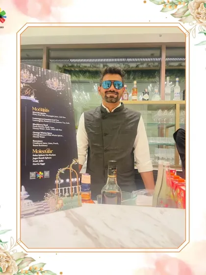 Our expert mixologist stands ready at his station, with a custom menu for mocktails and molecular drinks displayed. This image shows our preparedness and the diverse beverage options we offer.