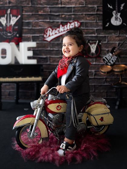 Vroom vroom! This birthday boy is having a blast on his miniature motorcycle.