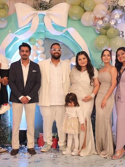 A lovely group photo with family and friends at the pastel-themed baby shower for Baby Jain.