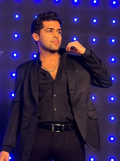 Sharp in black. A classic look against a cool blue-lit background.