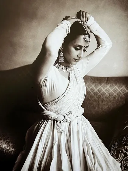 Getting ready for a historical-themed photoshoot, adjusting my headpiece. This image captures the preparation and detail that goes into each artistic project.