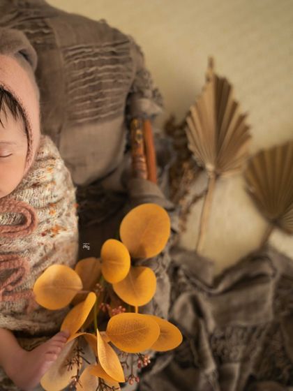 A detailed shot focusing on the textures of the setup, with the baby's tiny foot peeking out.