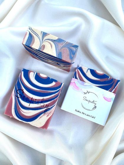The Daisy Dream Girl soap, a patriotic swirl of red, white, and blue.